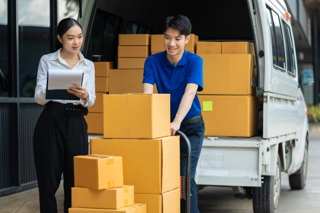 Asian delivery man deliver box parcel package to customer at home in the sun, shipping delivery concept.